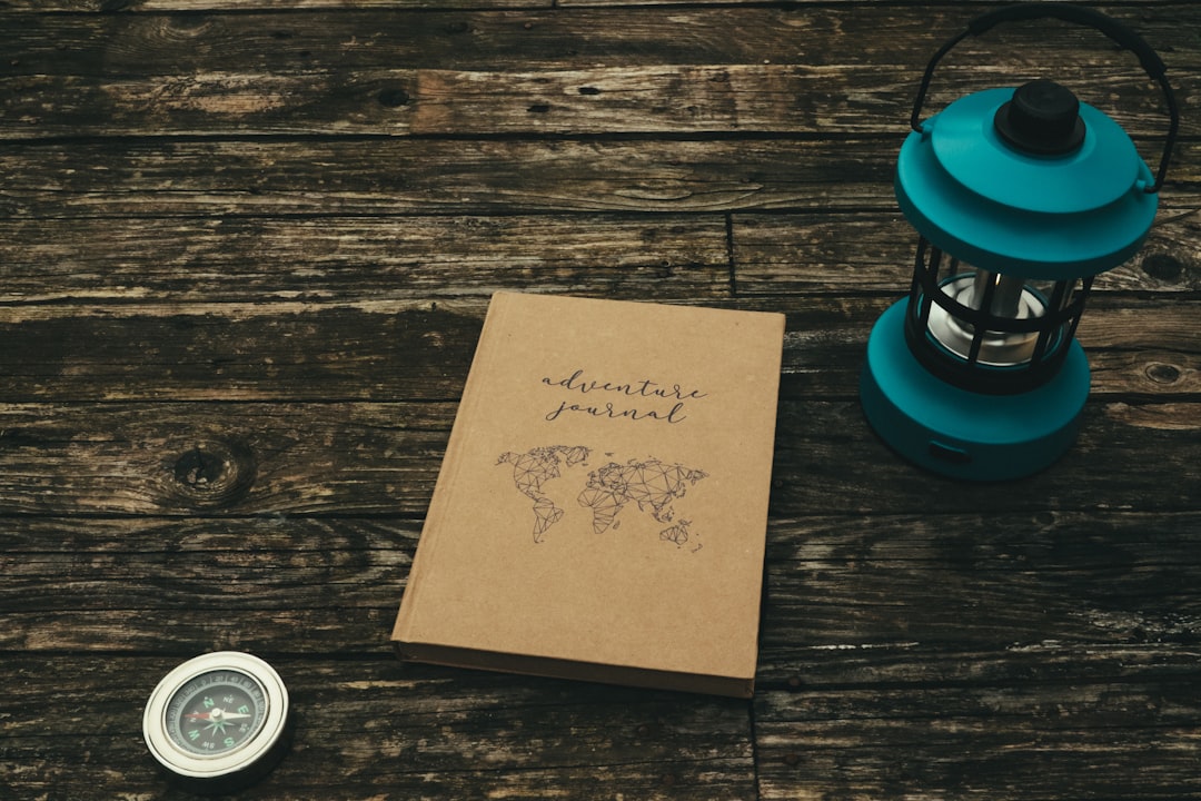 A book and a cup of coffee on a wooden table